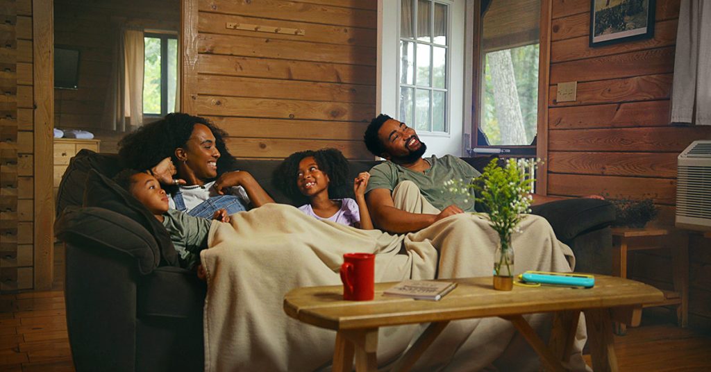 Family enjoying a cabin at Drummer Boy Camping Resort