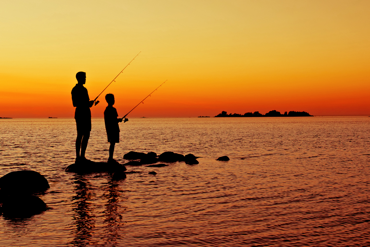 Boys Fishing At Sunset
