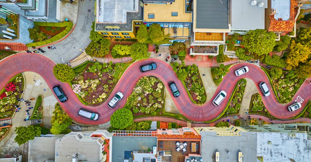 Aerial straight down over Lombard Street with cars and road running horizontally