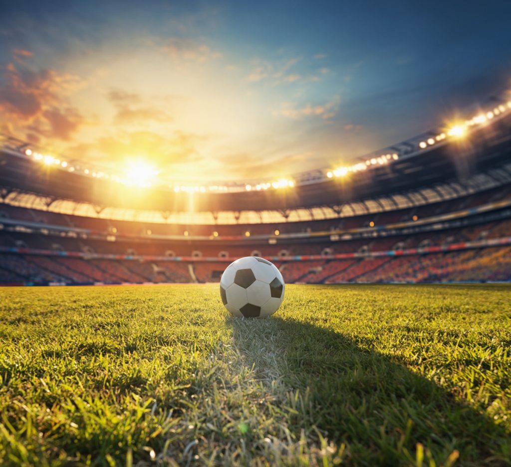 Soccer in the middle of the field inside a stadium